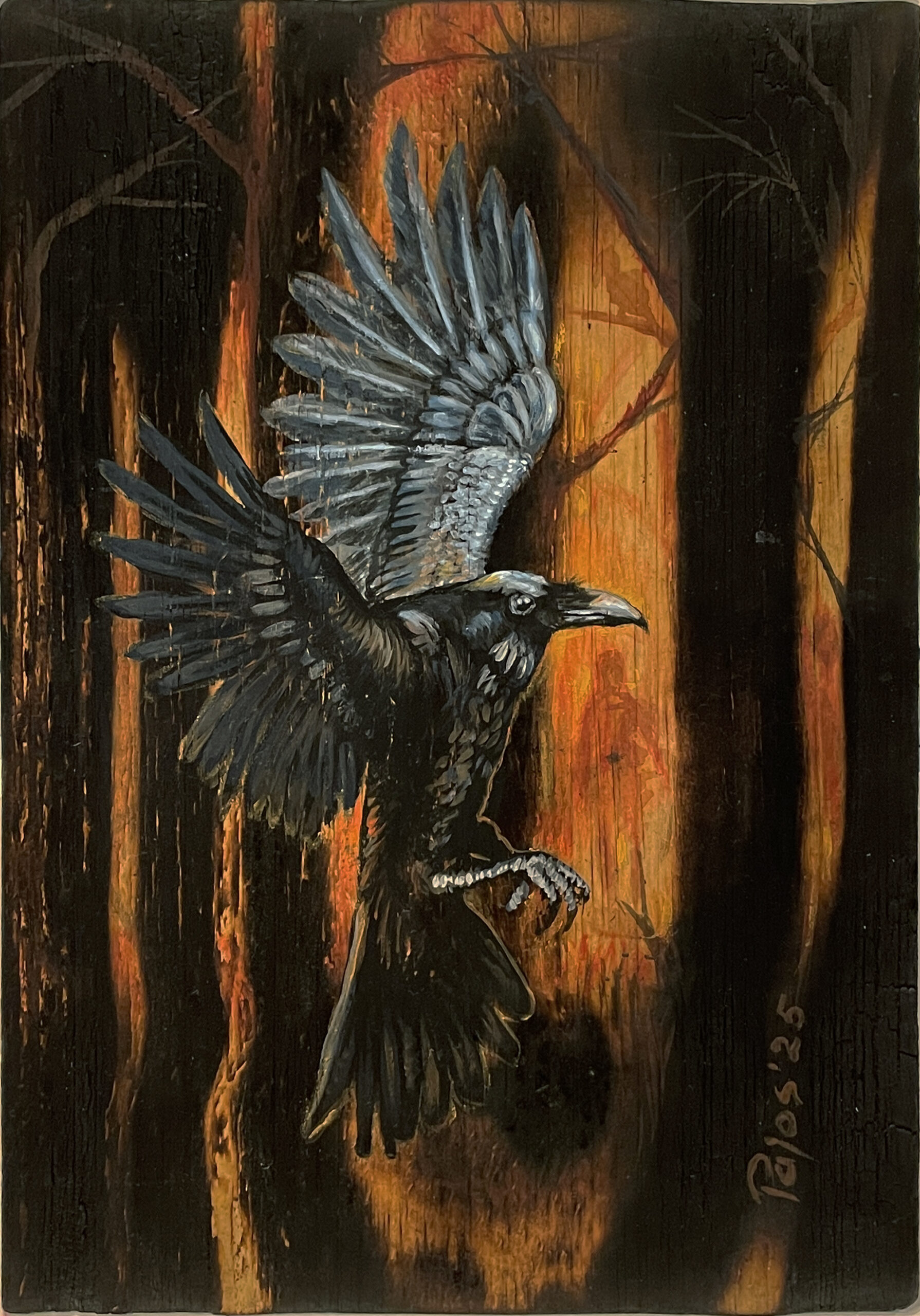 A black raven with wings spread wide, caught in mid-flight against a dark, burned forest glowing with orange firelight, painted in acrylic on charred wood.